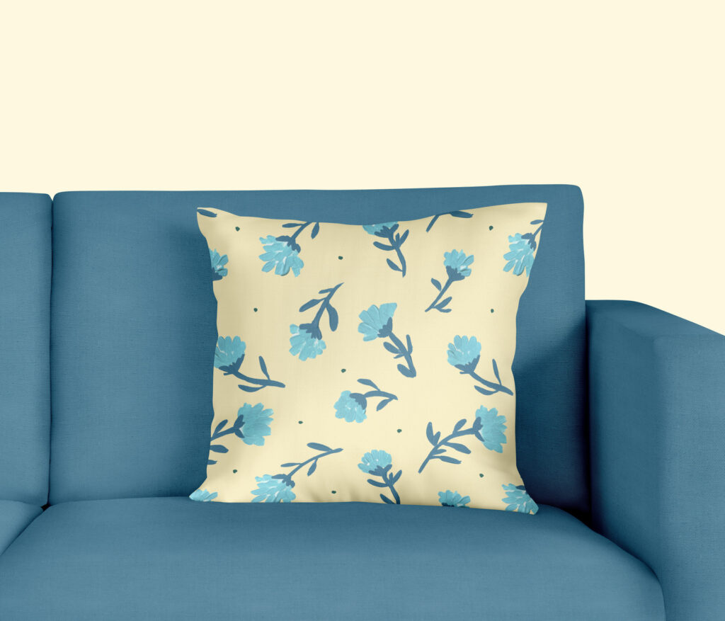 mock up blue flowers on soft yellow pillow on blue couch